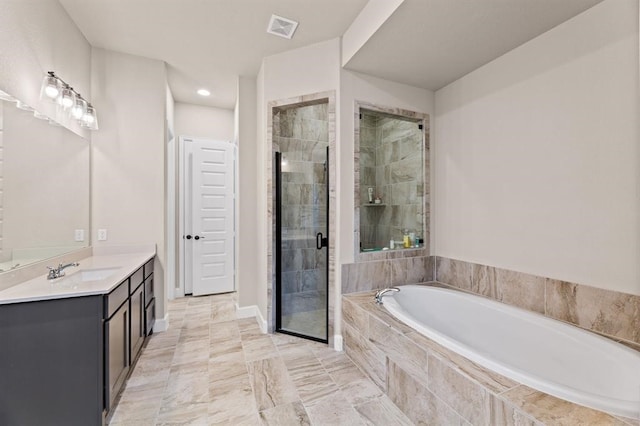 bathroom featuring vanity and shower with separate bathtub