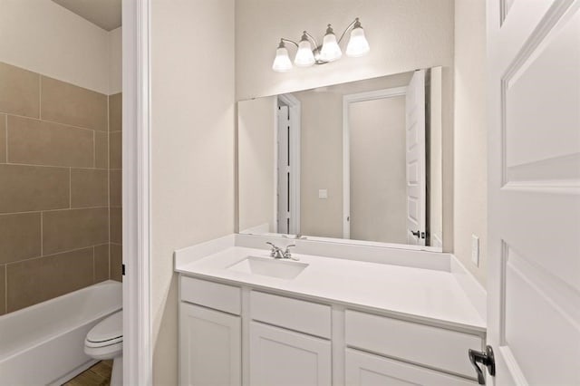 full bathroom with vanity, toilet, and tiled shower / bath combo