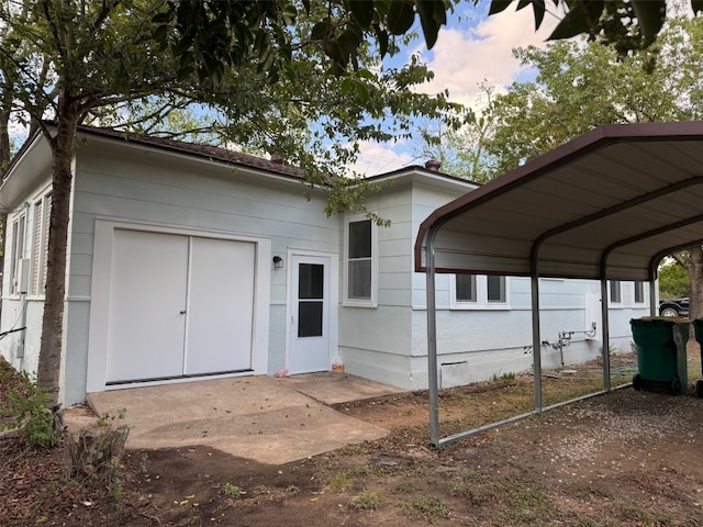 exterior space with a carport