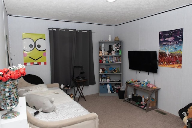 bedroom with a textured ceiling, visible vents, and carpet