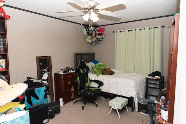 bedroom with carpet flooring, ceiling fan, and ornamental molding