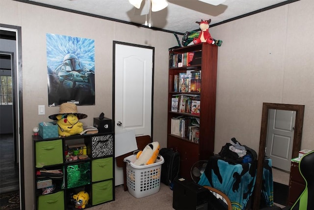 interior space with ceiling fan