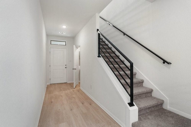 stairs with wood-type flooring