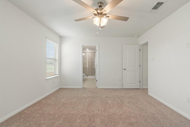 unfurnished room with light carpet and ceiling fan