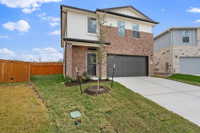 view of front of house with a garage and a front yard