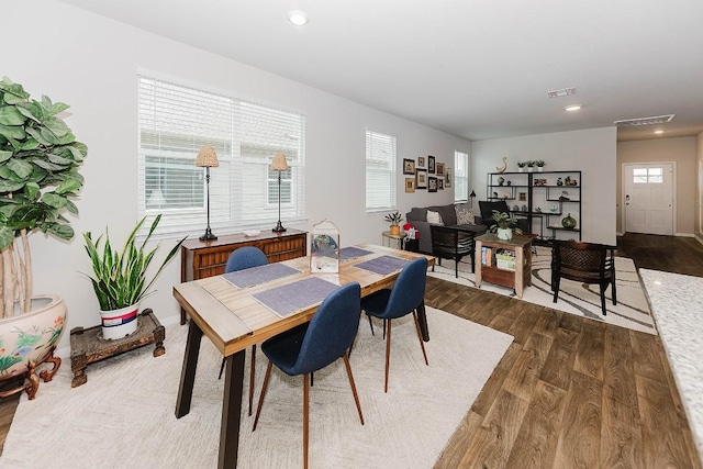 dining space featuring dark wood-type flooring