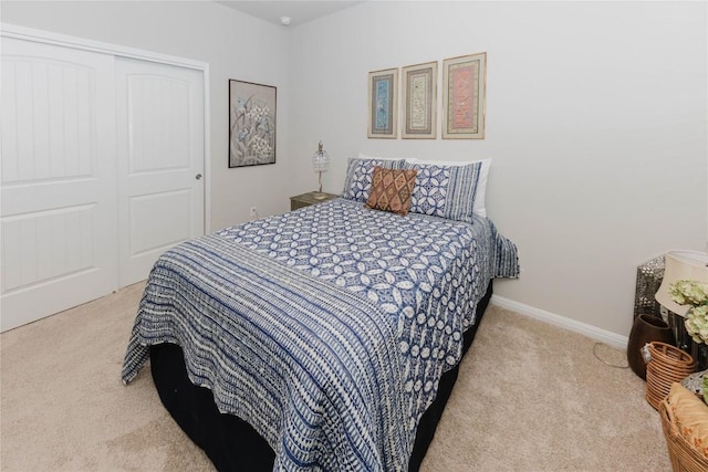 carpeted bedroom featuring a closet