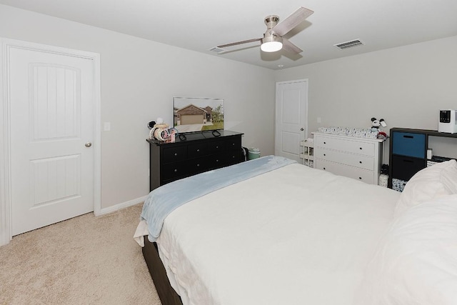 bedroom featuring light colored carpet and ceiling fan