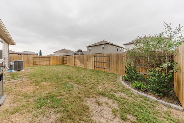 view of yard with central AC