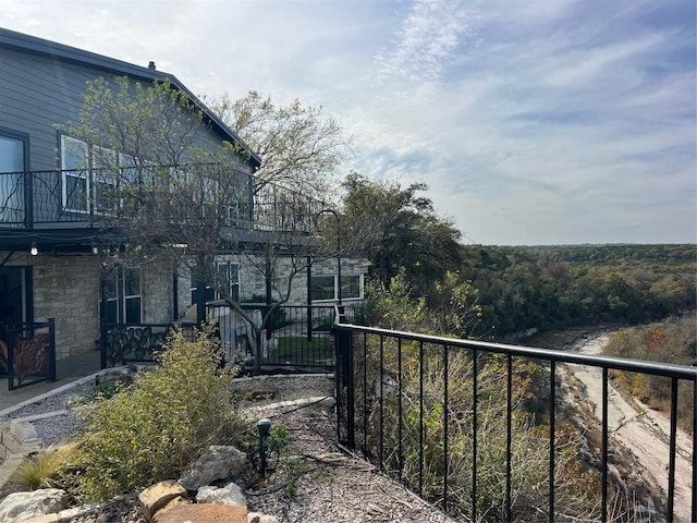 view of yard featuring a balcony