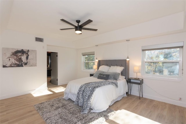 bedroom featuring ceiling fan and light hardwood / wood-style flooring