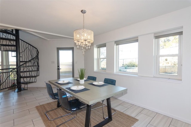 dining room featuring an inviting chandelier and a wealth of natural light