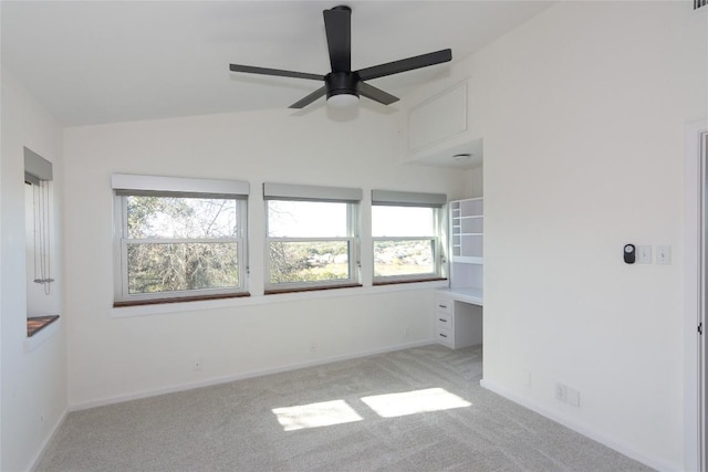 unfurnished bedroom with ceiling fan, light carpet, and lofted ceiling