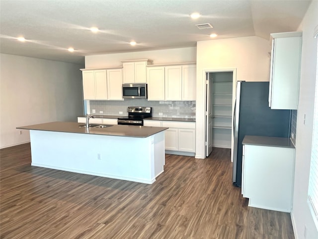 kitchen featuring tasteful backsplash, stainless steel appliances, sink, dark hardwood / wood-style floors, and white cabinetry