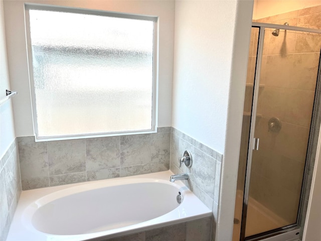 bathroom featuring plus walk in shower