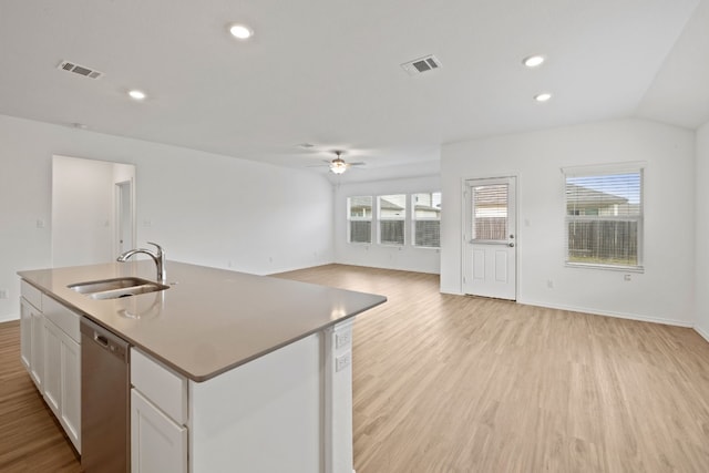 kitchen with dishwasher, sink, light hardwood / wood-style flooring, a kitchen island with sink, and white cabinets