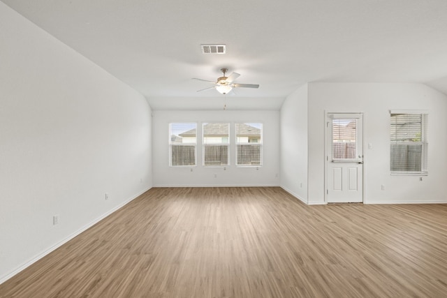 unfurnished living room with light hardwood / wood-style floors, ceiling fan, and lofted ceiling