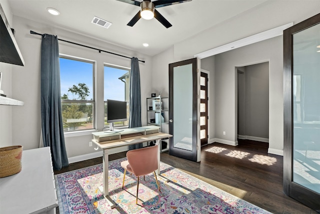 office featuring dark wood-type flooring, french doors, and ceiling fan