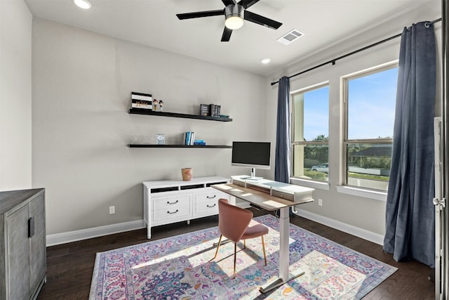 home office with dark hardwood / wood-style flooring and ceiling fan