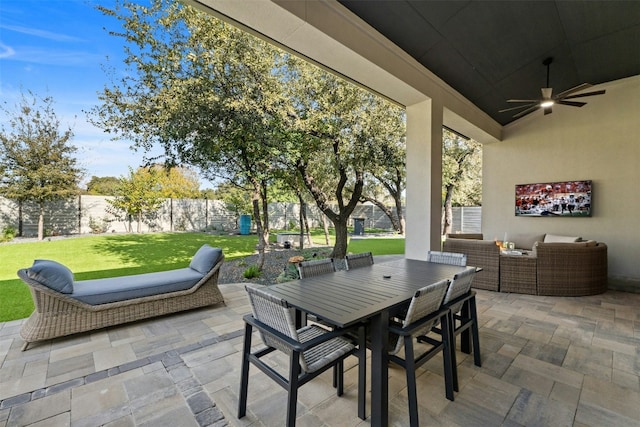 view of patio with an outdoor living space and ceiling fan