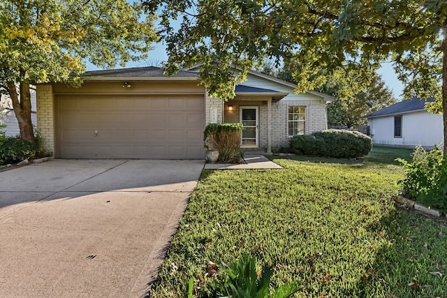 ranch-style home with a front lawn and a garage