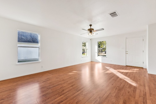 empty room featuring ceiling fan and wood-type flooring