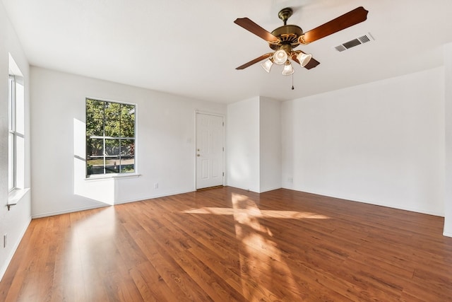 unfurnished room featuring hardwood / wood-style flooring and ceiling fan