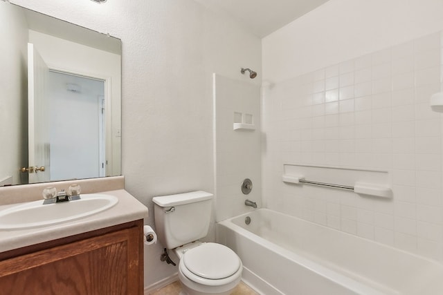 full bathroom with vanity, tiled shower / bath combo, and toilet