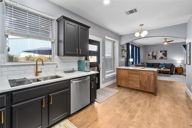 kitchen with ceiling fan, dishwasher, sink, hanging light fixtures, and light wood-type flooring