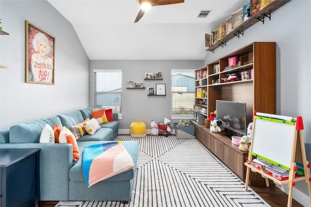 playroom featuring ceiling fan and lofted ceiling