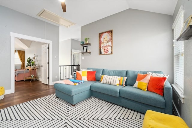 living room with dark wood-type flooring and lofted ceiling