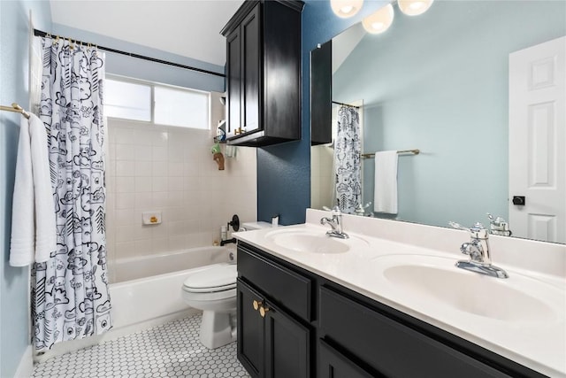 full bathroom with toilet, tile patterned floors, vanity, and shower / bath combo with shower curtain