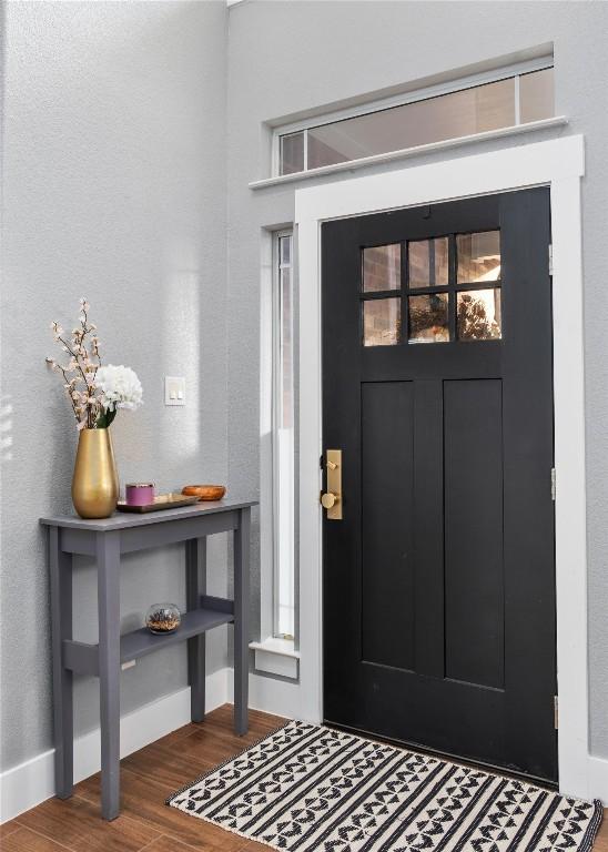 foyer with wood-type flooring