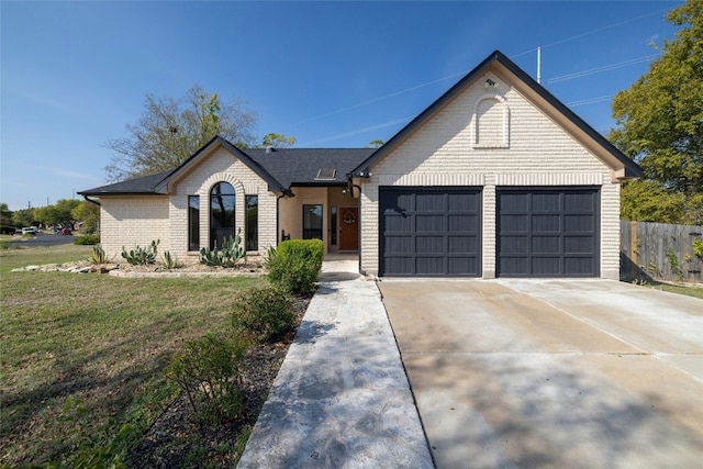 view of front facade with a front lawn and a garage