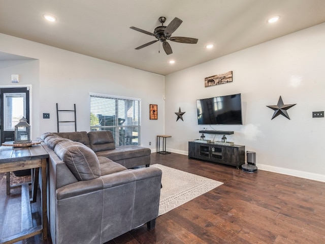 living room with ceiling fan and dark hardwood / wood-style floors