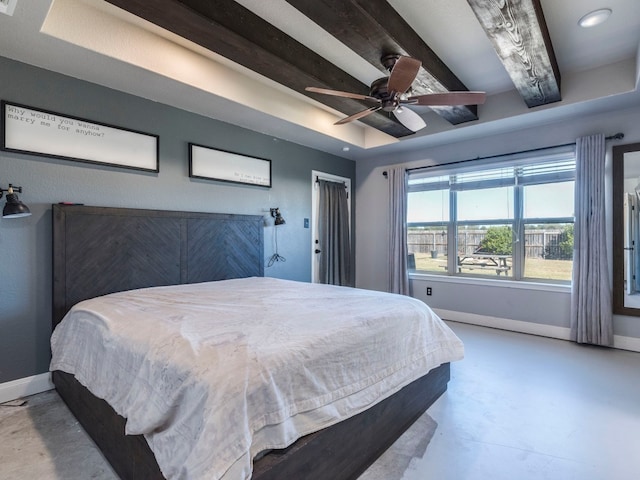 bedroom with ceiling fan, beamed ceiling, and concrete flooring