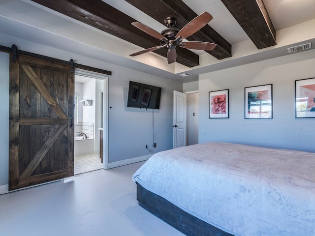 bedroom featuring ensuite bathroom, a barn door, beam ceiling, and ceiling fan