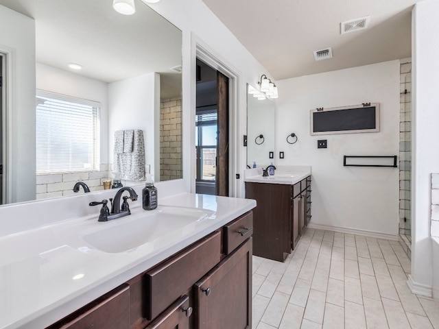 bathroom with tile patterned flooring and vanity