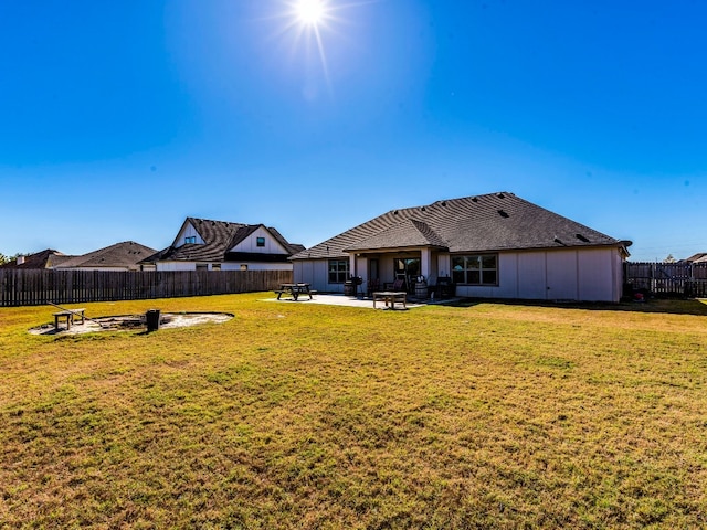 view of yard with a fire pit and a patio area