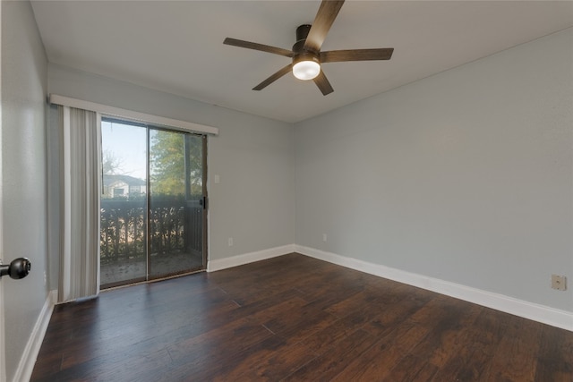 empty room featuring ceiling fan and dark hardwood / wood-style flooring