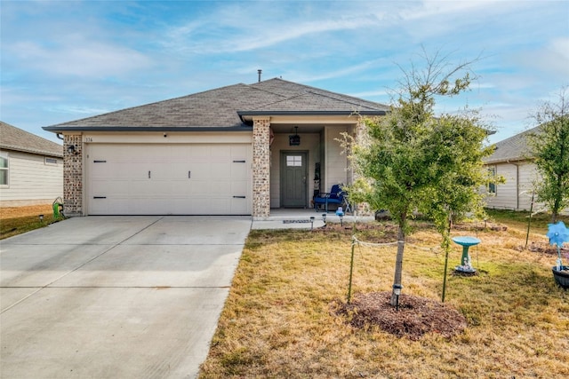 view of front facade with a front lawn and a garage