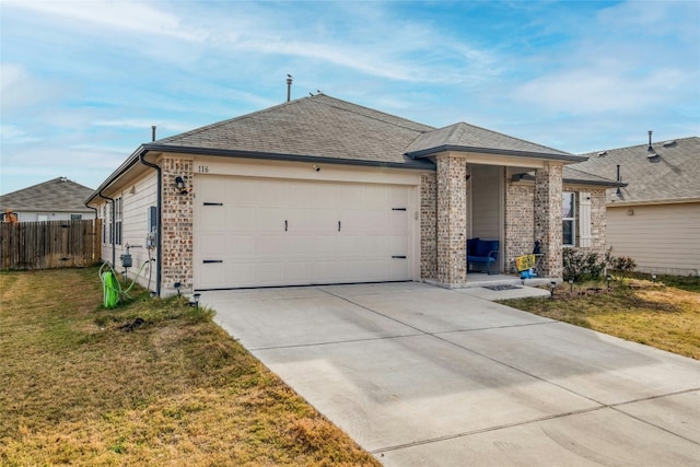 ranch-style home with a front lawn and a garage