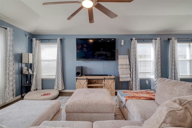 living room featuring hardwood / wood-style floors, plenty of natural light, ceiling fan, and lofted ceiling