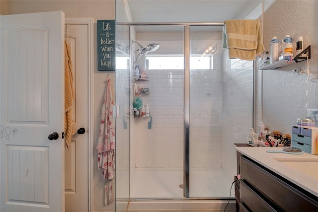 bathroom featuring vanity and walk in shower