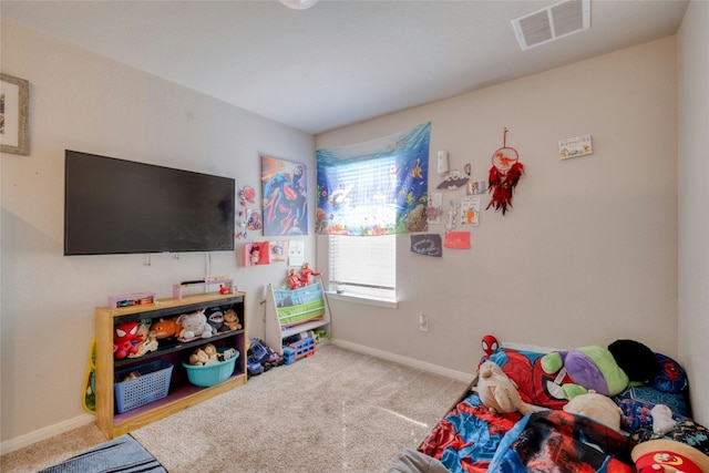 recreation room with carpet flooring