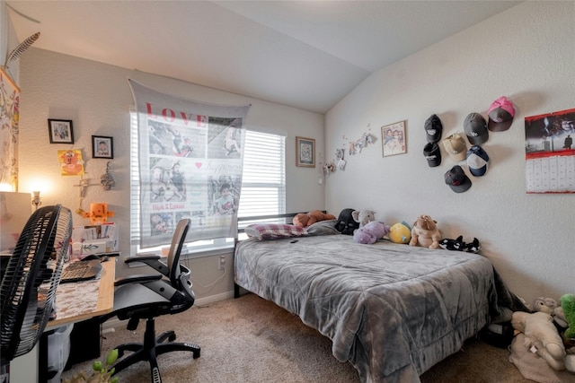 carpeted bedroom with vaulted ceiling