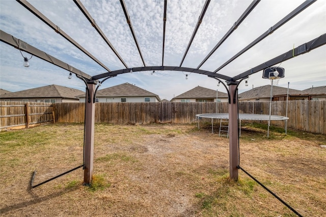 view of yard featuring a trampoline