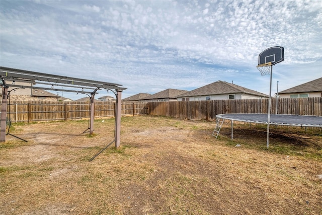 view of yard with a trampoline