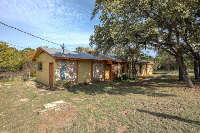 exterior space with a lawn