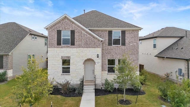 front facade featuring a front yard